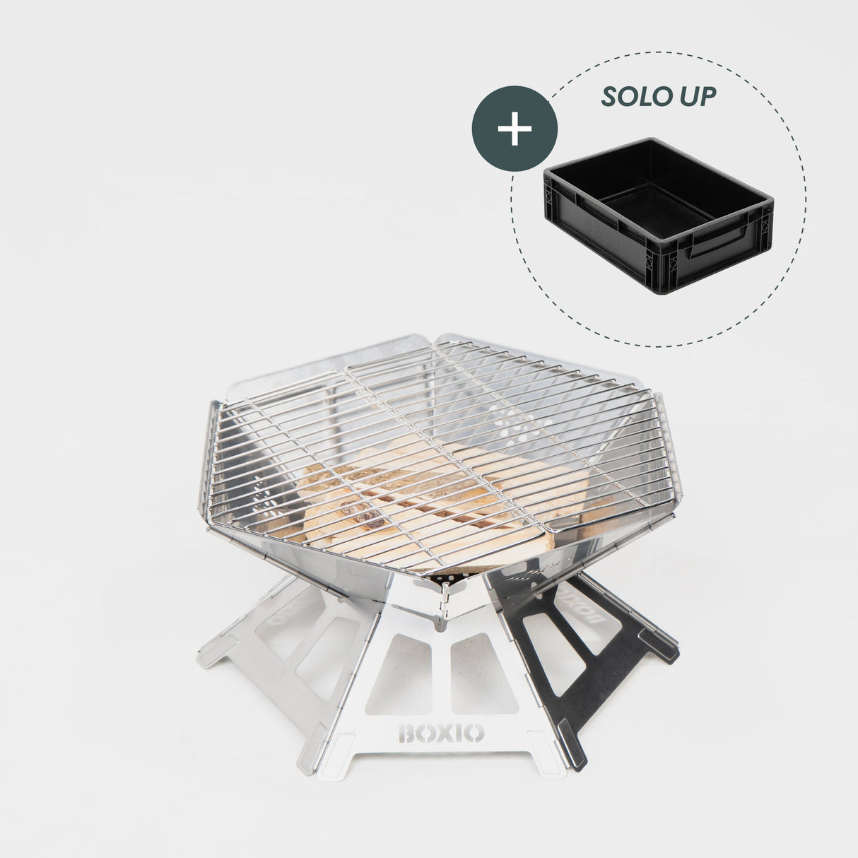 Robuster Edelstahl-Grill mit Holzkohleschicht und Grillrost, daneben schwarzer Aufbewahrungskasten.